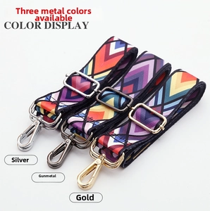 Detail of colorful woven ethnic strap with silver, gunmetal, and gold metal hooks