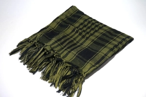 Detail of green and black checkered Shemagh scarf with tactical cotton fringe tassels