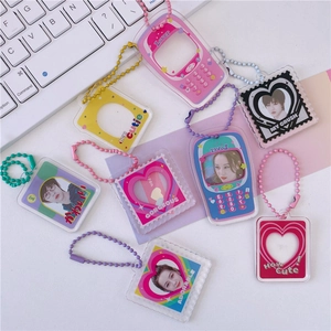 DIY acrylic photocard holder keychains in heart and phone shapes for K-pop stars