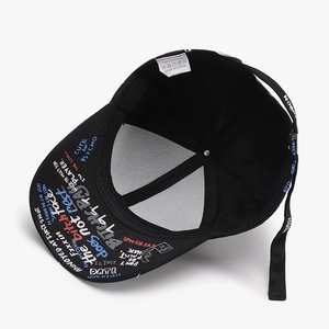 Black baseball cap interior view with colorful graffiti slogans on the brim and cotton lining