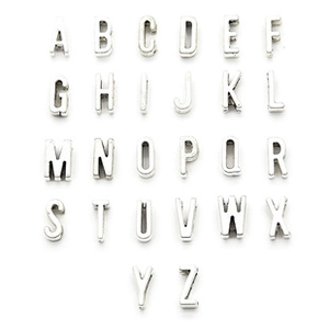 Detailed flat lay of 26 silver alphabet metal charms for DIY jewelry making