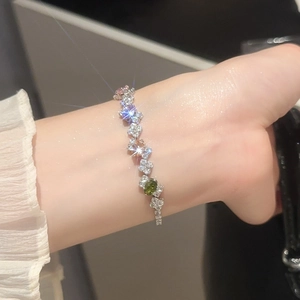 Detailed view of elegant zircon bracelet with colorful oval and heart shaped gemstones