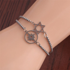 Detail of silver double-layer stainless steel bracelet featuring star-shaped pendants
