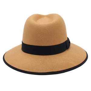 Detail of camel wool felt fedora featuring a wide brim with black contrast piping