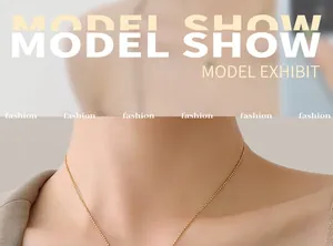 Detail of a thin gold beaded popcorn chain necklace worn by a model for a lifestyle look
