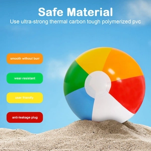 Detail of multi-color inflatable beach ball with leak-proof valve on sandy shore
