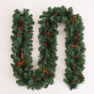 Flexible 2.7m Christmas garland with dense green pine needles, pine cones and red berries