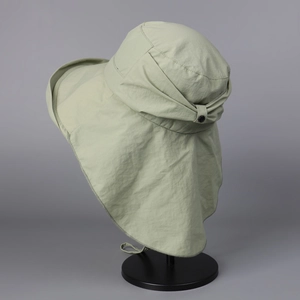 Detail view of wide brim sun hat with adjustable neck flap and windproof chin strap