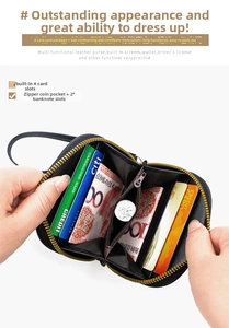 Detail of black leather wallet interior with 4 card slots and central zipper pocket