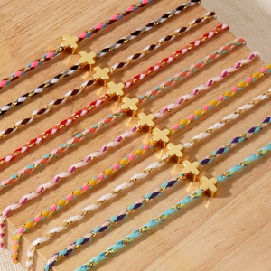 Set of 10 handmade colorful braided cotton bracelets with polished gold metal cross charms