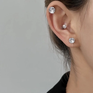 Three-piece magnetic zircon ear bone clips showing different sizes on model ear