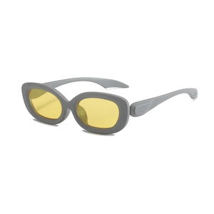 Retro oval sunglasses with matte grey frames and vibrant yellow lenses in Y2K style