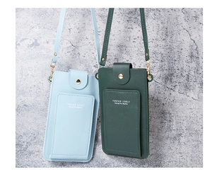 Close-up of light blue and dark green crossbody phone bags with Forever Lovely logo