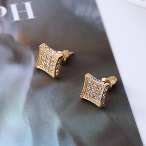 Close-up of square gold-plated stud earrings featuring pave-set sparkling zircons