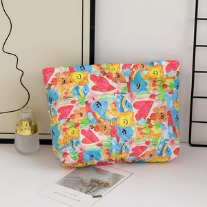Quilted cotton makeup bag with colorful cartoon prints in a cozy lifestyle setting