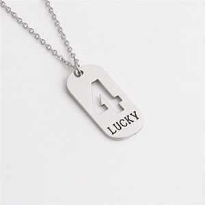 Macro shot of silver titanium steel necklace featuring hollow number 4 and LUCKY engraving