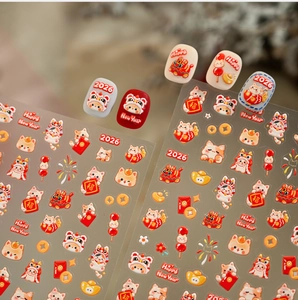 Detailed view of 2026 Lunar New Year nail stickers with cartoon lion and gold ingot designs