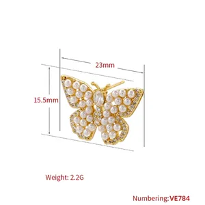 Elegant 18K gold brass butterfly stud earrings with micro-set pearls and rhinestones