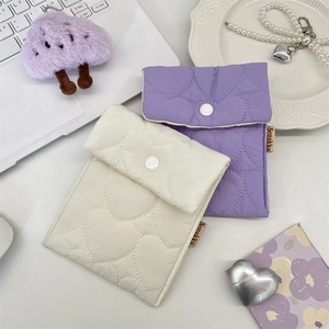 Quilted heart sanitary napkin pouch in cream and lavender with secure snap button closure