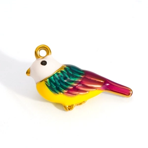 Macro view of a colorful bird-shaped 18k gold plated stainless steel enamel pendant