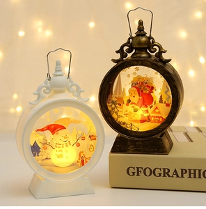 Detail of a vintage bronze Christmas LED lantern with Santa graphics and warm festive lights