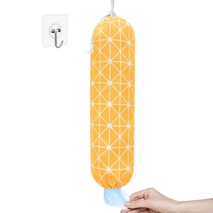 Wall-mounted orange canvas grocery bag dispenser with white geometric grid pattern