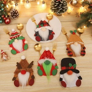 Set of 6 Christmas gnome cutlery holders with sequins and plaid details on wood background