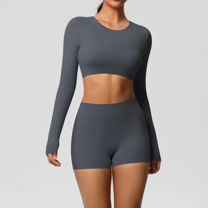 Detail of dark grey brushed yoga set featuring long sleeve crop top and high waist shorts