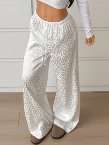 Women's leopard print wide-leg trousers with high-waisted drawstring in satin finish