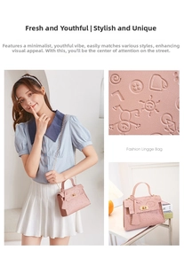 Detailed close-up of pink embossed leather handbag with golden lock and chain strap