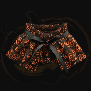 Halloween pet cape collar with orange pumpkin patterns and a black satin decorative bow