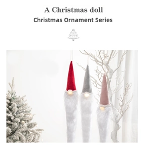 Three glowing Christmas gnomes with long hats and white beards hanging on snowy branches
