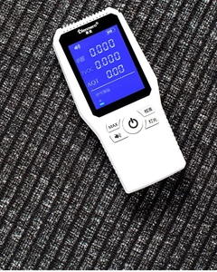 Close-up of portable air quality monitor showing real-time HCHO and TVOC data