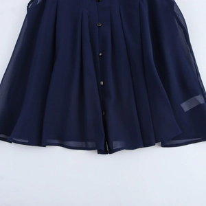 Sleeveless navy blue chiffon blouse with pleated texture and button down detailing