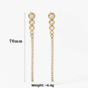 Detail shot of long gold tassel zircon earrings with 70mm length and 6.4g weight specs