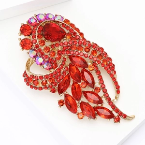 Vintage gold alloy brooch with red and purple rhinestones in feather leaf design