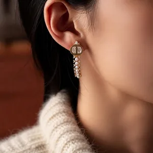 Elegant 18k gold plated C-shaped earrings with pearls and crystals in luxury style