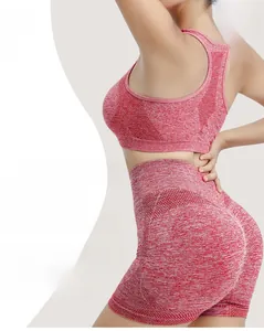 Detail of high-elasticity breathable pink yoga shorts with butt-lifting effect on model