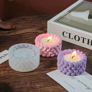 Close-up of woven texture silicone mold with pink and purple candle finished products