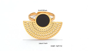 Detailed view of a gold titanium steel ring with black round inlay and fan-shaped cutout