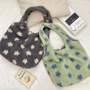 Detail of plush floral tote bag showing soft fleece texture and checkered lining