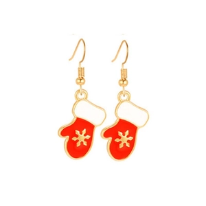 Detailed view of red Christmas mitten earrings with white snowflake patterns and gold edges