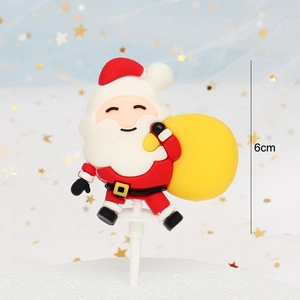 Close-up of a 6cm cartoon Santa Claus cake topper with a yellow bag for festive decor