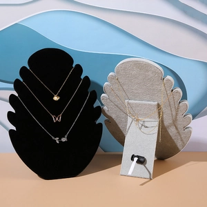 Detail of velvet necklace busts in black and grey for jewelry display and photography