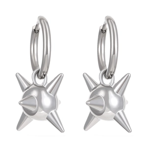 Macro detail of silver punk hoop earrings featuring metallic spike ball pendants