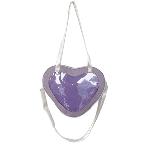 Detailed view of purple heart-shaped ita bag with clear PVC window and adjustable strap