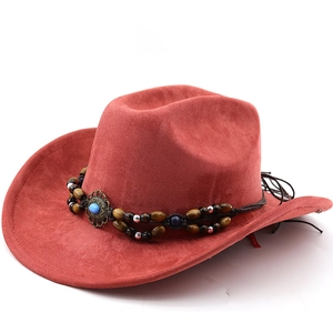 Detail view of red suede cowboy hat with ethnic woven band, beads and turquoise stone