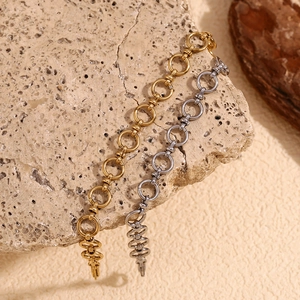 Minimalist 14K gold and silver plated stainless steel chain link bracelets on stone