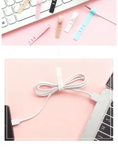 Detailed view of colorful silicone cable ties for organizing USB wires and headphones