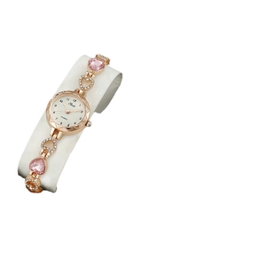 Luxury rose gold women's watch set featuring heart-shaped pink gems and diamond-set chains